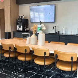 a community kitchen with a table and chairs