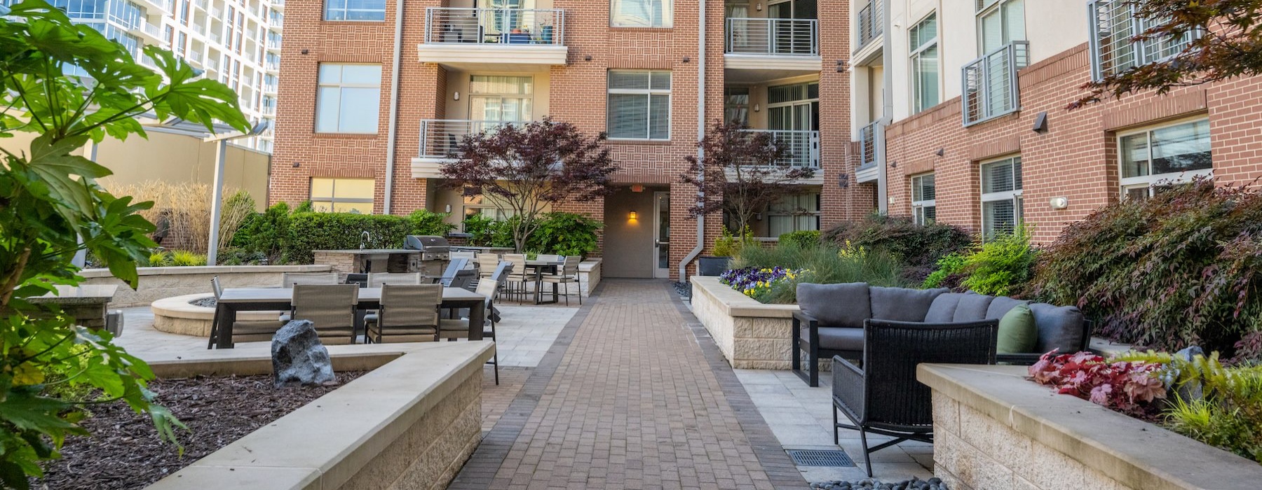 a courtyard with tables and chairs