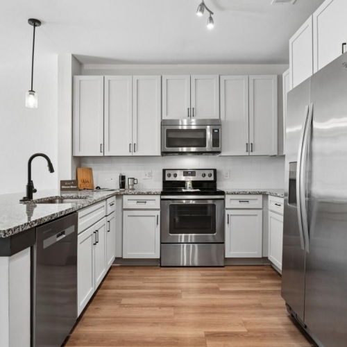 a kitchen with white cabinets