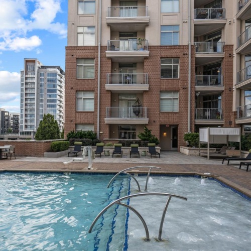 a swimming pool in front of a building