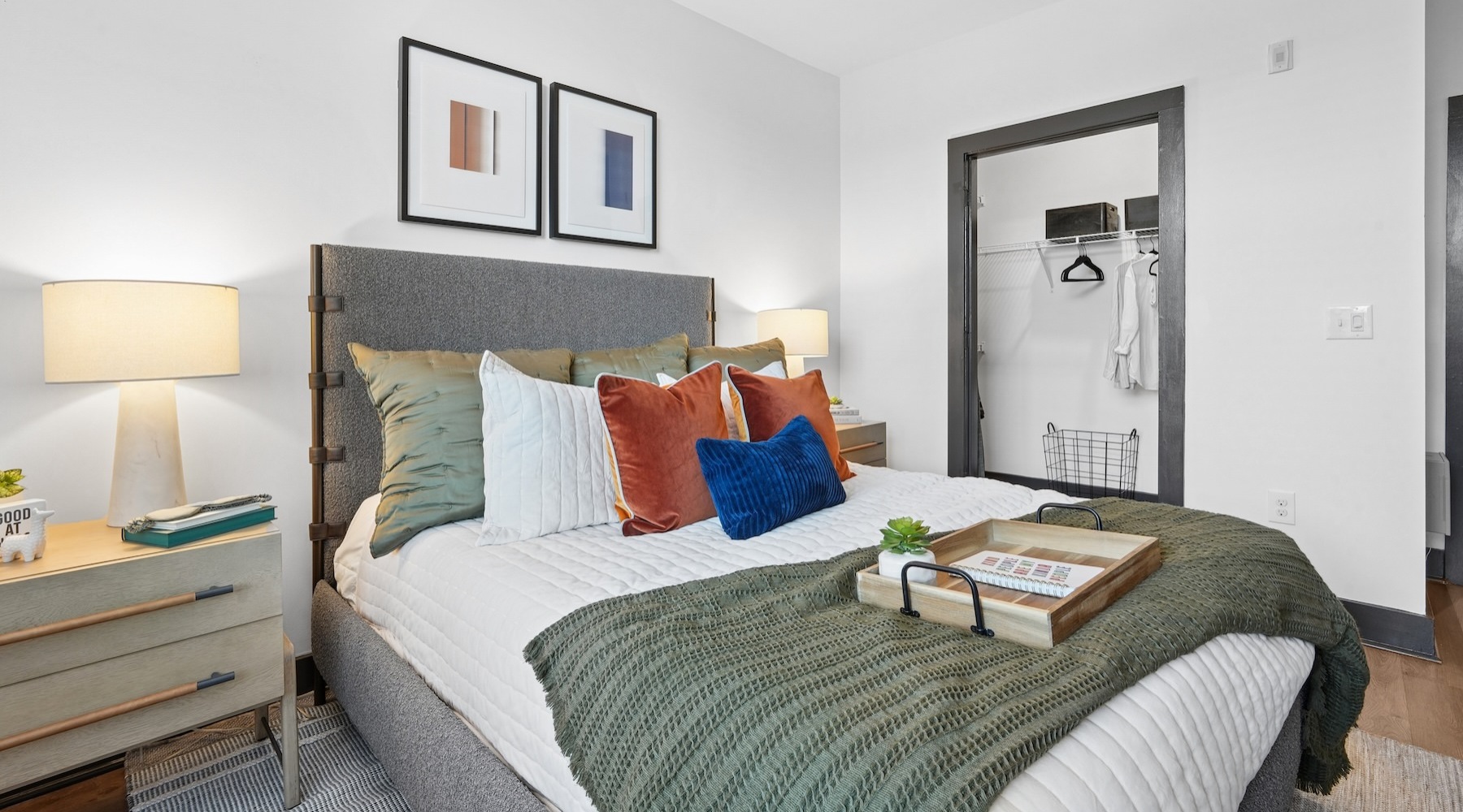 a bedroom with a bed and two nightstands