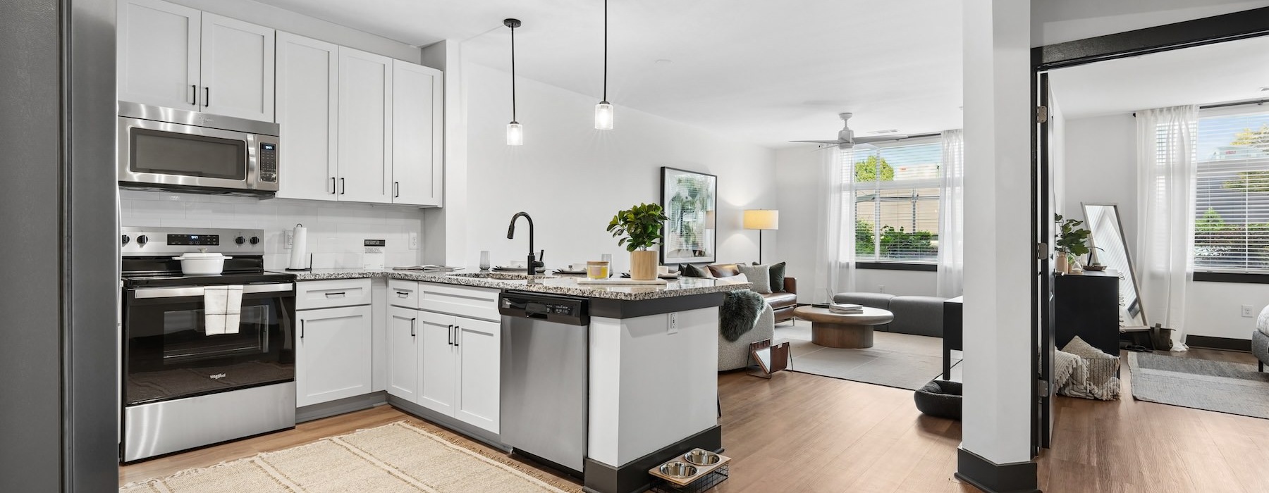 a kitchen with white cabinets