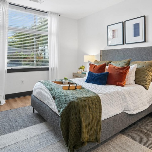 a bedroom with a bed and two nightstands